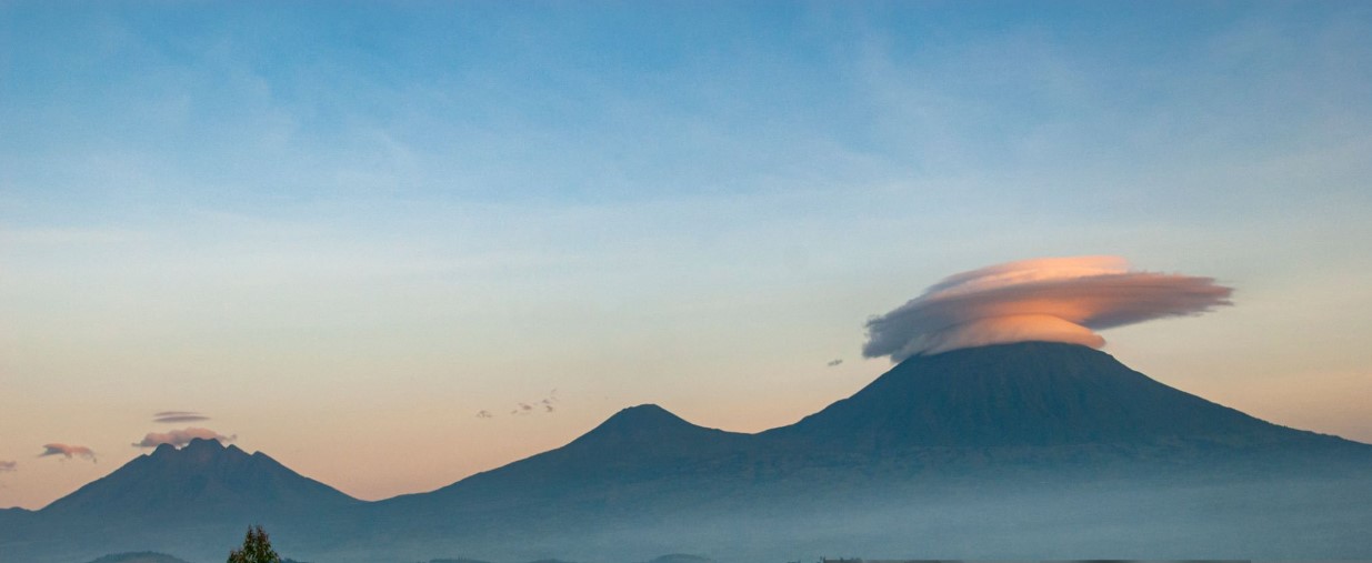 Scenic view of Volcanoes National Park with towering volcanoes and lush landscapes in the Virunga Range